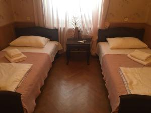 Rúm í herbergi á Guest House Kartuli Suli