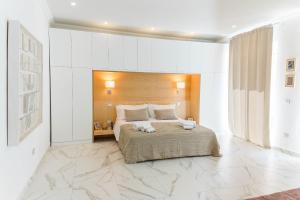 Postel nebo postele na pokoji v ubytování Luxury Suite Corso Umberto
