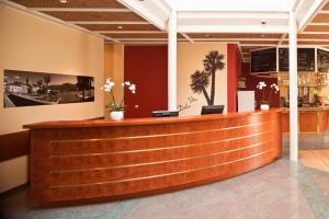 a lobby of a restaurant with a reception desk at Hapimag Resort Ascona in Ascona