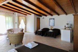 a living room with a couch and a table at Casa Lupita - Private Family Villa with Pool & Garden in Terracina