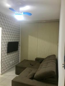 TV a/nebo společenská místnost v ubytování Jardim das Palmeiras