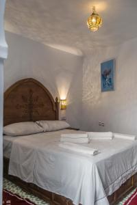 En eller flere senge i et værelse på dar solaiman