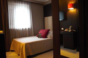 Postel nebo postele na pokoji v ubytování Hotel Ansharius - Adults only