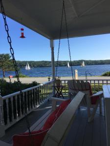 a porch swing with a view of the water at Toba's Bed & Breakfast in East LaHave