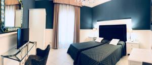 Postel nebo postele na pokoji v ubytování Hotel Goya