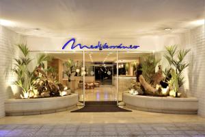 a lobby with a sign that reads antislittle at Mediterraneo Sitges in Sitges
