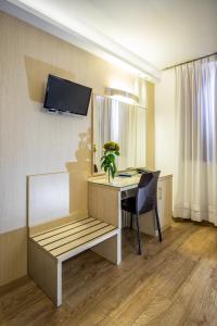 TV a/nebo společenská místnost v ubytování Hotel Residence Ristorante Ramandolo