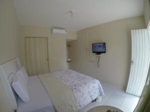 a hospital room with a bed and a tv on the wall at Pousada e Restaurante Manaím in Passa e Fica +32 photos