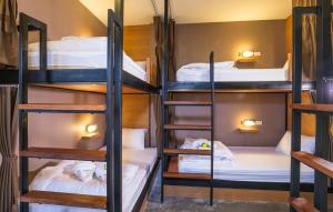 a group of bunk beds in a room at Srisuksant Square in Krabi town