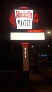 a sign for a morocco motel at night at Monticello Motel in Portland