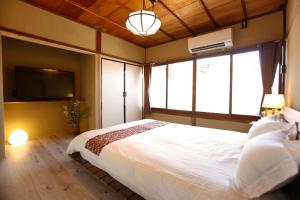 Rúm í herbergi á Kyoto Nishijin Shichiban Tei (No7)