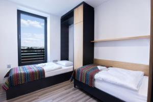 Postel nebo postele na pokoji v ubytování Beachwell
