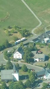 an aerial view of a town with houses and a road at Villa Jani b&b in Breitscheid