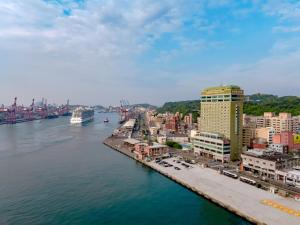 an aerial view of a city next to the water at Evergreen Laurel Hotel - Keelung in Keelung