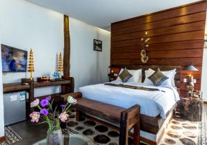 Giường trong phòng chung tại Khmer Paradise Villa
