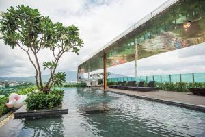 a swimming pool in the middle of a building at The Astra A719 in Chiang Mai