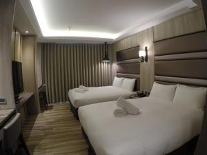 正巧文旅 蔬食友善旅館客房内的一张或多张床位