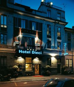 a hotel direct sign in front of a building at Hotel Dieci in Milan