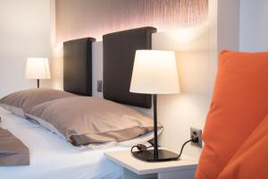 Postel nebo postele na pokoji v ubytování Hotel Jardin Bern
