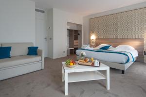Postel nebo postele na pokoji v ubytování Hotel & Spa Radiana