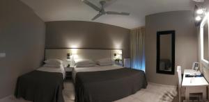 Ένα ή περισσότερα κρεβάτια σε δωμάτιο στο Hotel Ancora SANXENXO