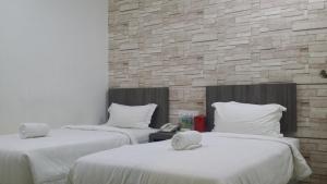 Voodi või voodid majutusasutuse Twenty Nine Hotel toas