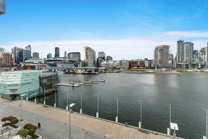 a view of a city with a large body of water at Docklands Private Collection - NEWQUAY in Melbourne