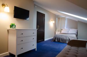 Postel nebo postele na pokoji v ubytování Szafirowy Dwór Hotel & Restauracja