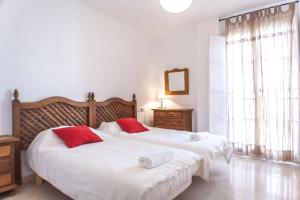 En eller flere senge i et værelse på Conde Ibarra Central