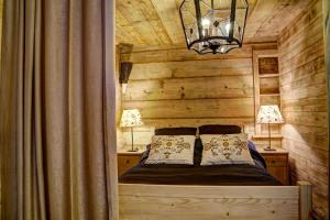 Posteľ alebo postele v izbe v ubytovaní Apartament Regionalny