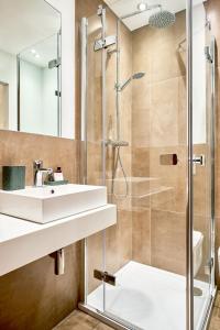 a bathroom with a sink and a shower at Pension Haus am Einberg in Meschede +38 photos