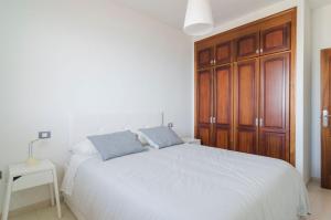 Ένα ή περισσότερα κρεβάτια σε δωμάτιο στο Ático Vistas Mar y Teide 518 +23 φωτογραφίες