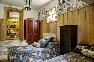 Posteľ alebo postele v izbe v ubytovaní Apartament Regionalny