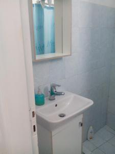 a bathroom with a sink and a mirror at Central Studio 1 in Heraklio