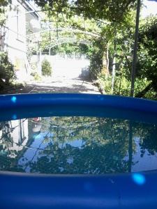 a view of the rear view mirror of a blue car at At Nana's in Lagodekhi