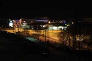 a city at night with street lights and buildings at Apartment Kirkkokatu in Raahe