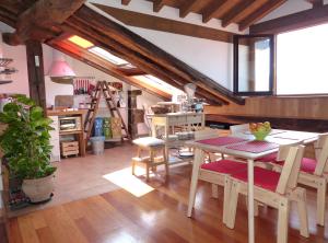 a kitchen with a table and chairs in a room at Handia - Basquenjoy in Hondarribia