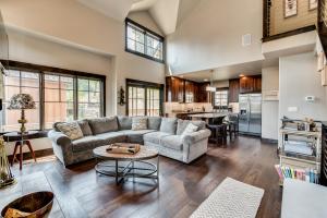 a living room with a couch and a table at Tamarack Townhouse in Donnelly