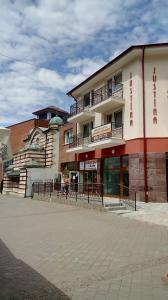 a building with a balcony on the side of it at Orava- Justína in Martinske Hole