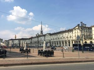 a large building with a fountain in the middle of a street at TORINO VACANCY 4 - Bridge House in Turin