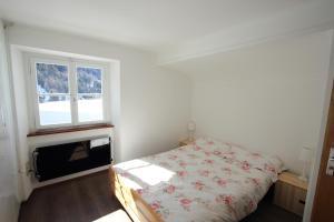 Voodi või voodid majutusasutuse Chalet Cuore delle Alpi toas