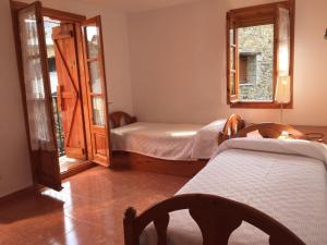 Giường trong phòng chung tại Casa Marsial