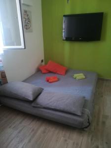 Säng eller sängar i ett rum på A casa di Gigi e Fra