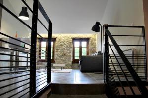 a staircase leading to the living room of a house at Le Voltaire in Carcassonne