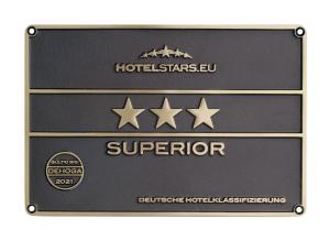 Um certificado, prêmio, placa ou outro documento exibido em Star G Hotel Premium München Domagkstraße