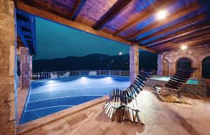 two chairs sitting in front of a swimming pool at Lastiver Resort in Yenokavan