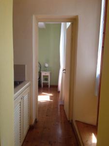 a hallway with a door leading into a room at La Casina del Borgo in Abbadia San Salvatore