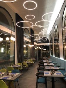Reštaurácia alebo iné gastronomické zariadenie v ubytovaní Intelier Victoria