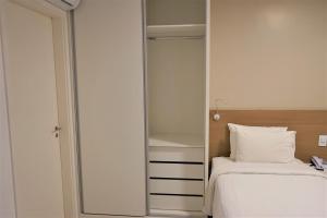Łóżko lub łóżka w pokoju w obiekcie Bittar Apart Hotel