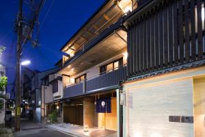 a building on a street at night at Ryokan Hostel Gion in Kyoto